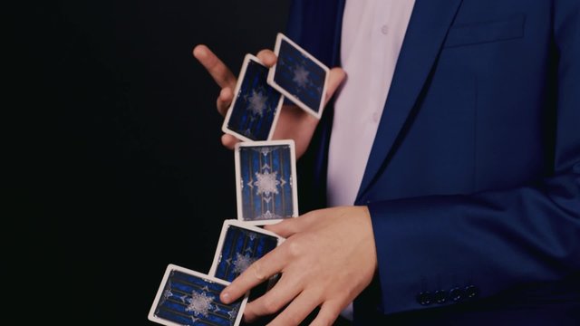 Hands magician with a deck of cards