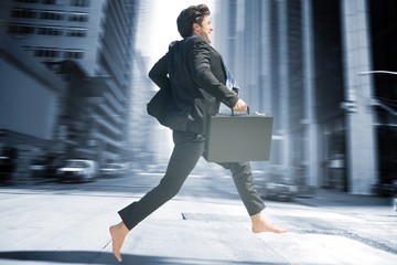 Composite image of businessman jumping