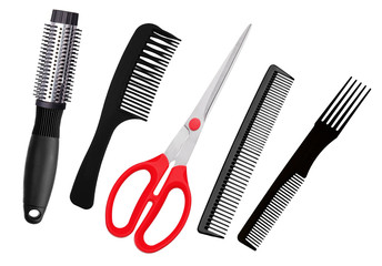 Red scissors and combs isolated on white