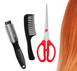 Red scissors, combs and red hair isolated on white