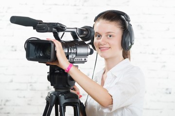 a pretty young woman with a professional camera