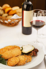 Breaded deep fried peppers/Breaded deep fried peppers with filled zucchini. Restaurant served meal.