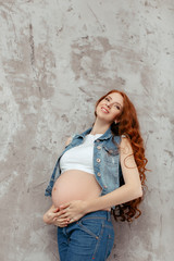Portrait of the young pregnant woman