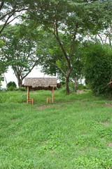 Thai style pavilion with thatched roof,sunset