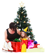 Mother and daughter around the Christmas tree