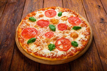 Delicious pizza with mozarella and tomatoes - Margherita