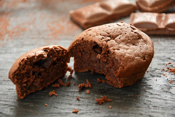 Homemade chocolate muffin on dark wooden background