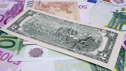 Two dollars and euro. Money
