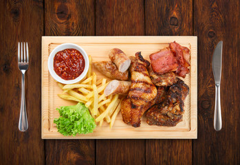 Restaurant food isolated - grilled meat assortment served on woo