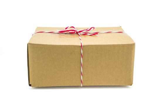 Parcel cardboard box and tied with string