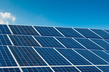 Solar panels on blue sky with copy space