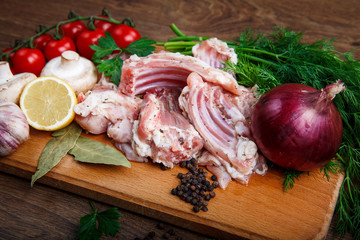 set of ingredients at wooden board for coocking meat meal