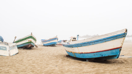 Naklejka na ściany i meble fishing boats in misty morning