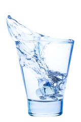 splash of water in an elegant glass with ice isolated on white background