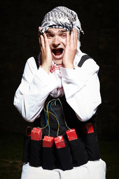 Portrait of man with vest of plastic explosives 