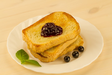 fresh french toast with honey and jam on a white plate with berries. healthy diet