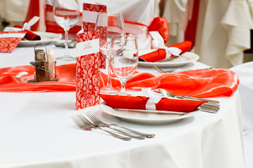 wedding tables set for fine dining or another catered event, red decoration