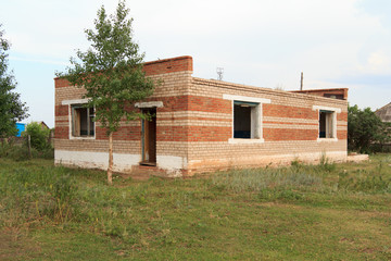 Dilapidated farmhouse from a red bricks