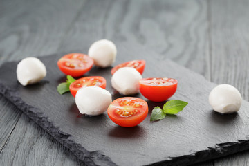 Fototapeta na wymiar mozzarella balls with tomatoes and basil