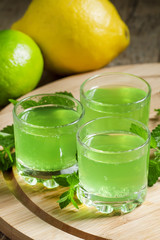 Citrus juice with soda in a glass on a wooden background, select