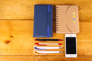 stationaries isolated with handphone on wooden background