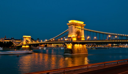 View of the famous chain bridge in Budapest at night.