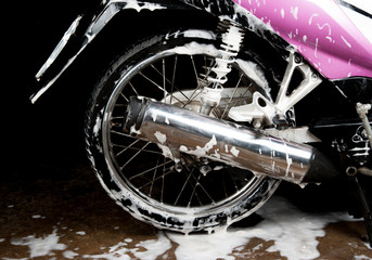 Fototapeta na wymiar Washing the Pink motorcycle