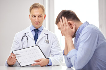 doctor and patient with cardiogram on clipboard