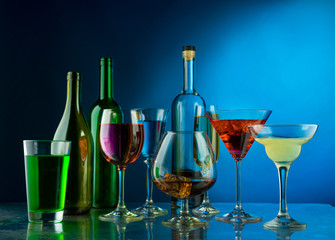 Many wine glasses on a blue background