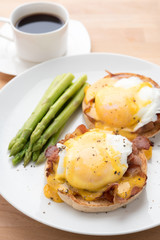 eggs benedict, on the wooden table