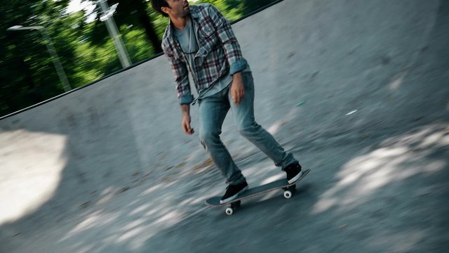 Skater performing stunts in a skatepark