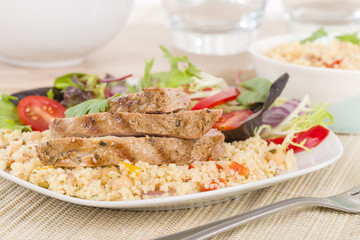 Grilled Pork & Couscous with Salad.
