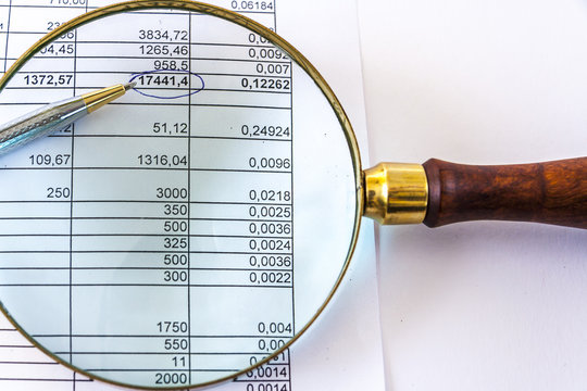 Magnifying Glass And Financial Document