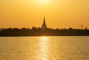 Fototapeta na wymiar Sunset scene of white pagoda