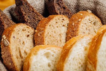 Different types of bread in the basket on the table