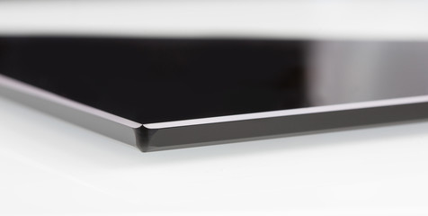 black sheet glass on a white. closeup