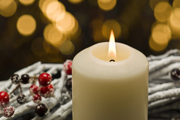 White candles in autumn winter decoration