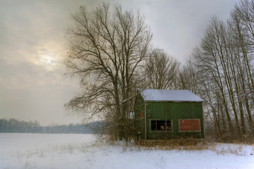 An old style tobacco kiln at sunset