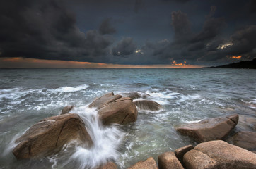 beautiful sunset strom with wave attack