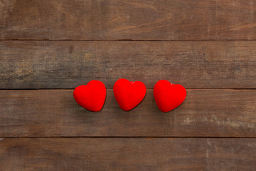 Valentines Day background with many Hearts on wood.