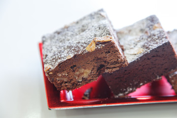 several chocolate cakes lies on a plate