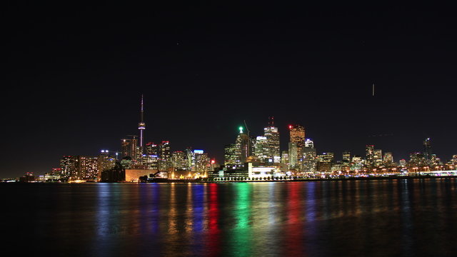 Toronto Night Skyline Timelapse 1. Toronto, Canada as seen from across the harbor at night, shot in long exposure time lapse. Rendered in 4K from high resolution still photographs.
