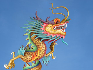 Fototapeta na wymiar Chinese dragon against blue sky