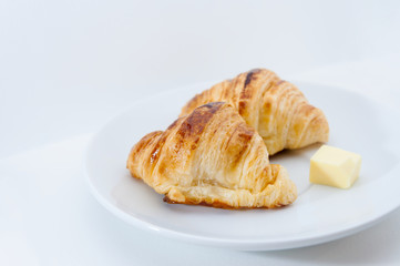 Croissants on dish with grey color background