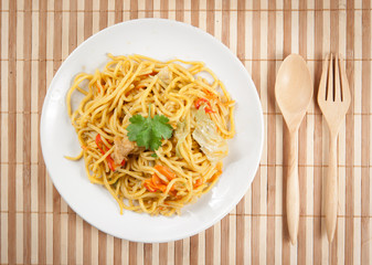 noodles and vegetables on wood