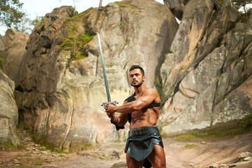 spartan on the background of rocky mountains, warrior, fighter h
