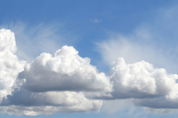 Naklejka na ściany i meble In the blue sky floating Cumulus clouds