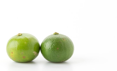 green lemon isolated on white background