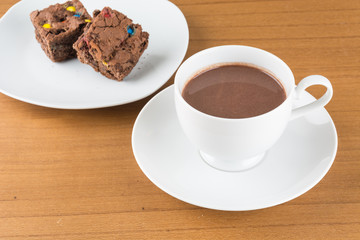 a cup of chocolate with brownie