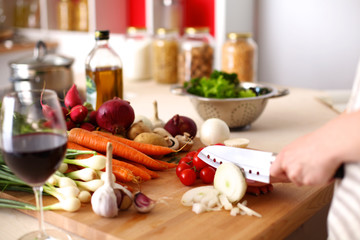 Cook's hands preparing vegetable salad - closeup shot